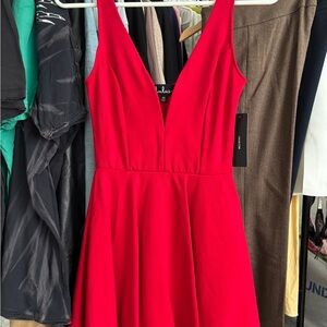 Lulus Vibrant Red Mini Dress With Sweetheart Neckline and Attached Shorts.